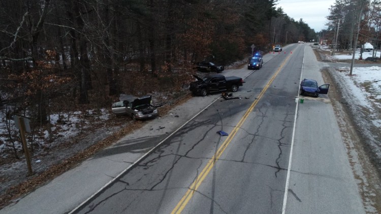 Police say Dale H. Tucker of Casco rammed his Chevy Cobalt, right, into two vehicles after losing control while trying to avoid a spike mat that was put down by deputies as he was fleeing police on Route 302 in Raymond on Sunday.