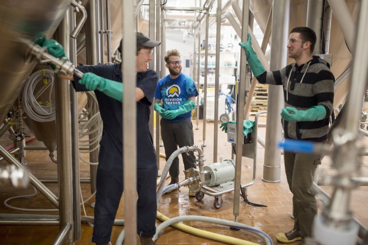 Maine Beer Company employees, from left, Phil Neil, Seth Gill and David Love all have paid sick days as part of their benefits at the Freeport brewery. The company, which employs about 50 full-timers, believes paid sick leave is "good for business," said co-owner Dan Kleban, "because workers are more productive if they're not coming to work sick."