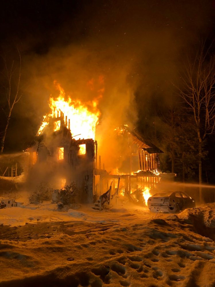 A house at 193 Boot Cove Lane in Winthrop burns early Saturday morning. No people were hurt in the fire, but a dog and cat perished, according to Winthrop Deputy Fire Chief Mark Arsenault. 