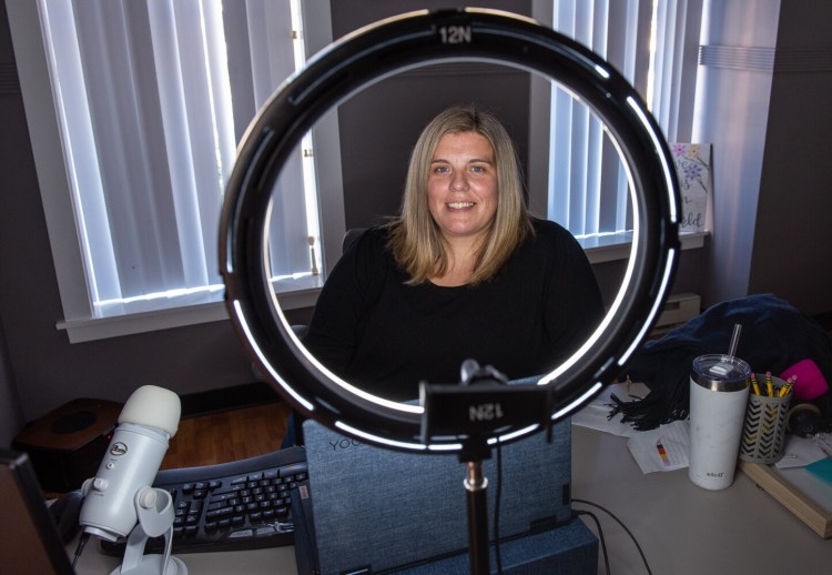 Kelly David sits at her desk Wednesday afternoon at Twelve North Agency at High Street and Minot Avenue in Auburn.