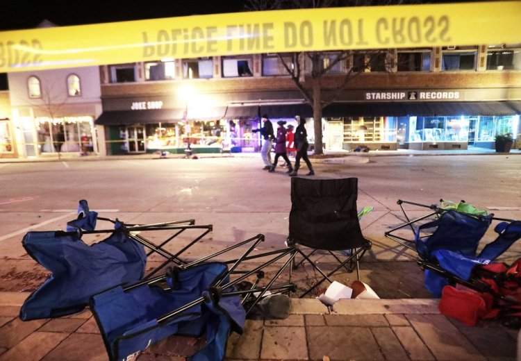 Toppled chairs line West Main Street in downtown Waukesha, Wis., after an SUV ran into a parade of Christmas marchers Sunday. 