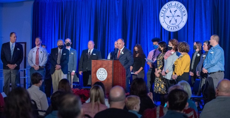 Auburn Mayor Jason Levesque, center, calls to order Monday night's 2021 Inauguration Ceremony at the Auburn Senior Community Center.