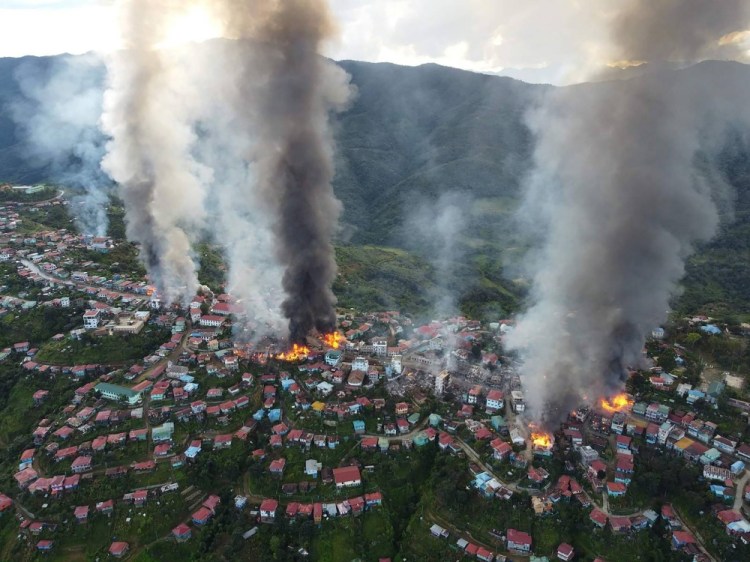 Fires burn in the town of Thantlang in Myanmar's northwestern state of Chin on Oct. 29.

