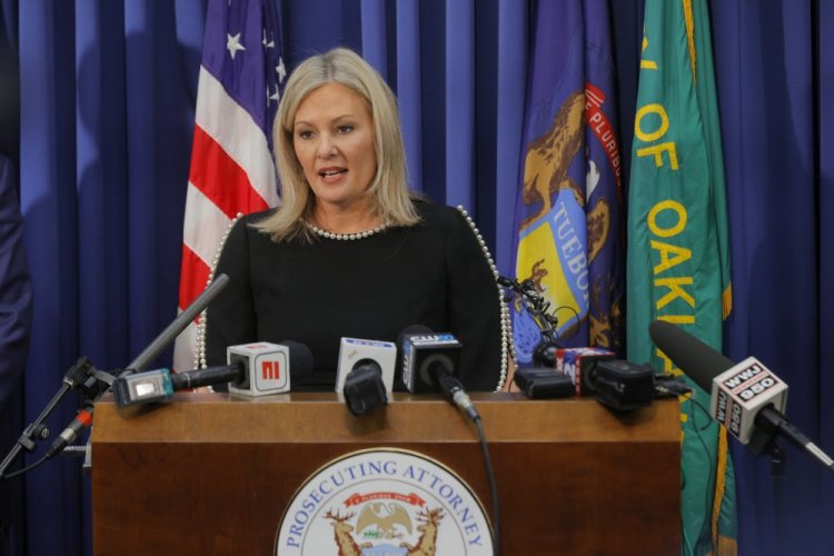 Oakland County prosecutor Karen McDonald addresses the media in her office on Friday in Pontiac, Mich. school.