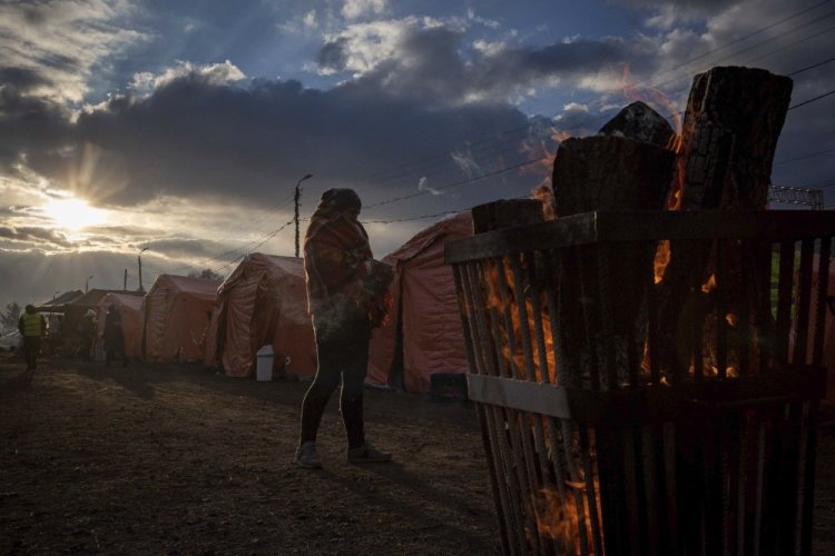 People at a makeshift camp wait to board a train heading for Krakow, after fleeing from Ukraine, at the border crossing in Medyka, Poland, on Thursday.