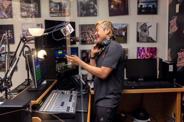 SCARBOROUGH, ME - JUNE 23: Jon “DJ Jon” Hawkins records at the Hot 104.7 FM studio on Thursday, June 23, 2022. Hawkins has spent the last few years trying to spread Kpop - Korean pop music - in Maine. He recently started playing Kpop late nights on Hot Radio 104.7, he also has a weekly Kpop show on community station WMPG, and manages a Kpop Maine website. (Staff photo by Brianna Soukup/Staff Photographer)