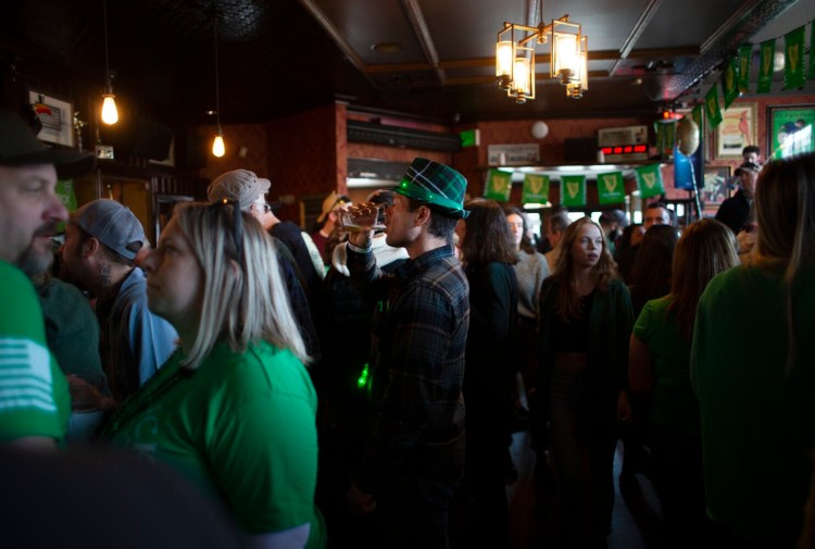 PORTLAND, ME - MARCH 17: Paul Proulx of North Yarmouth finishes his beer at Rí Rá in Portland on Thursday. (Photo by Derek Davis/Staff Photographer)