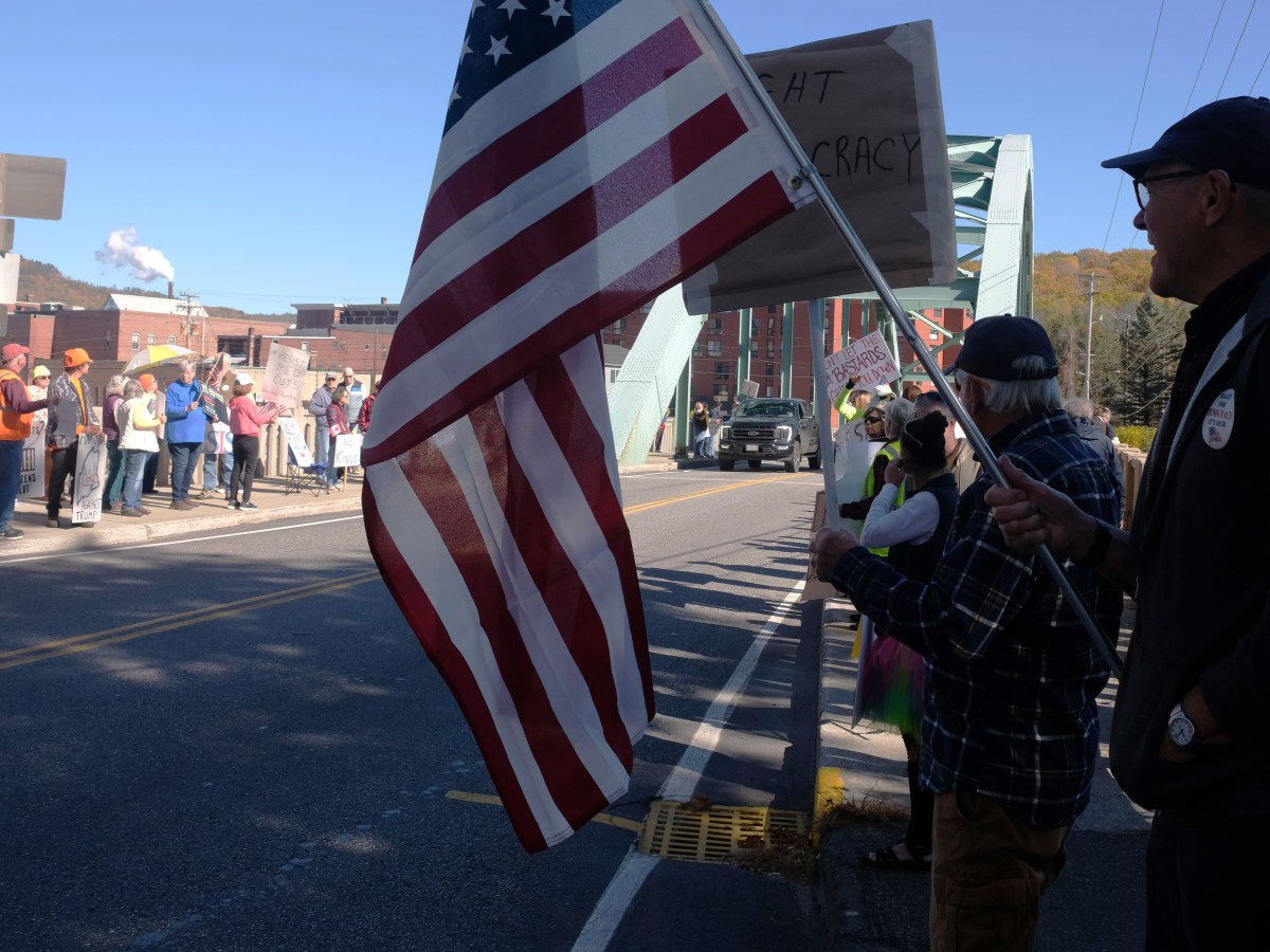 ‘No Kings’ protest draws 100 to bridge in Rumford